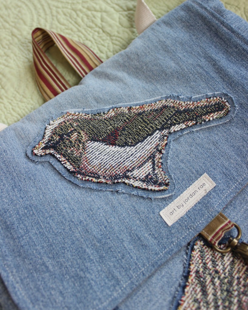 An up-close photo of a vireo patch on a handmade denim bag